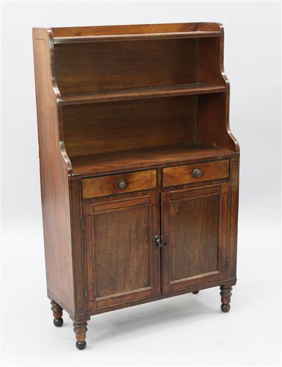 A Regency ebony strung mahogany waterfall bookcase, W.2ft 3in. D.11in. H.3ft 8in.